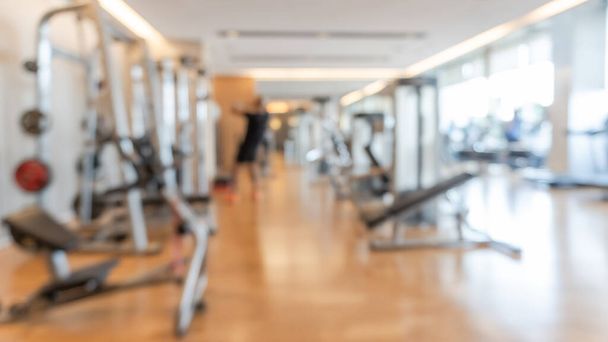 Gym blur background fitness center, workout personal training studio, health club with blurry sports exercise equipment for aerobic, bodybuilding and power strength class - Photo, Image