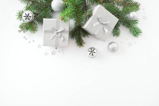 Christmas composition. Christmas decor, gift boxes, pine cones on white background. Top view, copy space. - Fotó, kép