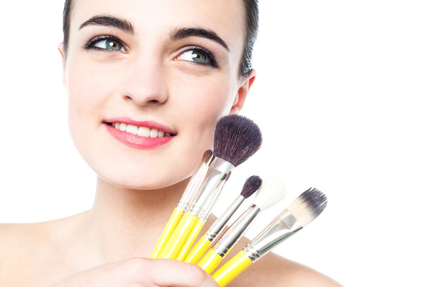 Glamorous girl with makeup brushes - 写真・画像