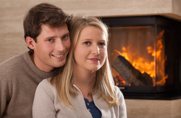 Young couple by fireplace - Photo, image