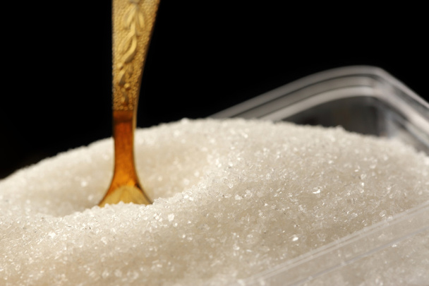 Açúcar branco e colher
 - Foto, Imagem