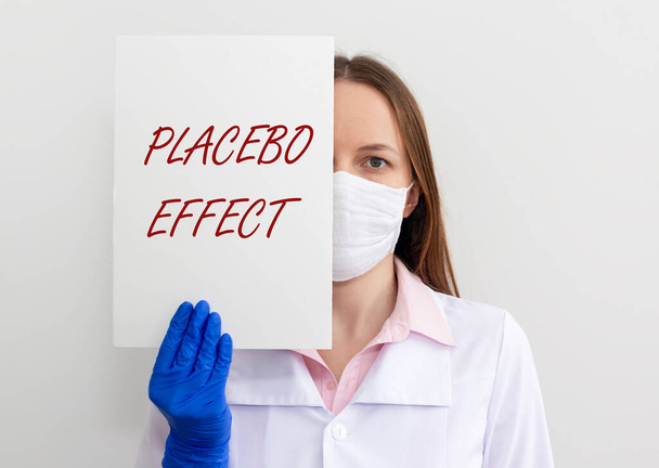 Placebo effect concept inscription. doctor hands showing paper close up. - Valokuva, kuva
