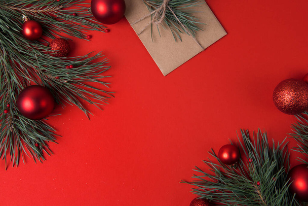 Christmas background on red with festive baubles - Foto, Imagen