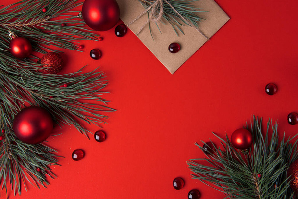 Christmas background on red with festive baubles - Photo, image