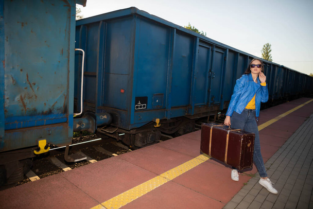 A teenager wants to go unconventional and take a holiday trip by train. - Фото, зображення