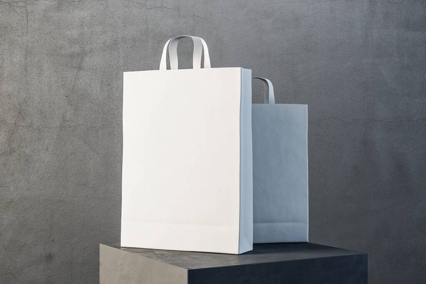 Two white paper bag with handles on podium. Trade and gift concept. 3D Rendering - Photo, image