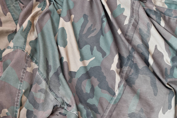 Camouflage background texture as backdrop for russian air forces design projects. Back side of troopers camouflage jacket with many pleats on crumpled fabric - Photo, Image