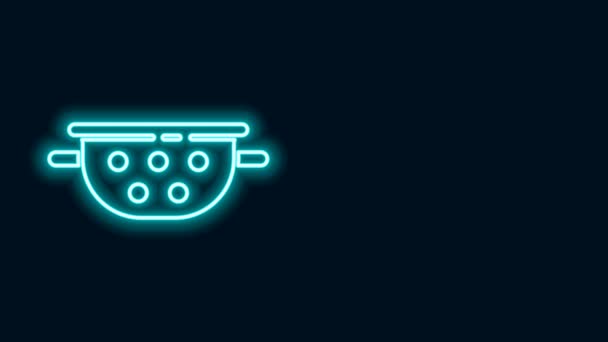 Glowing neon line Kitchen colander icon isolated on black background. Cooking utensil. Cutlery sign. 4K Video motion graphic animation - Footage, Video