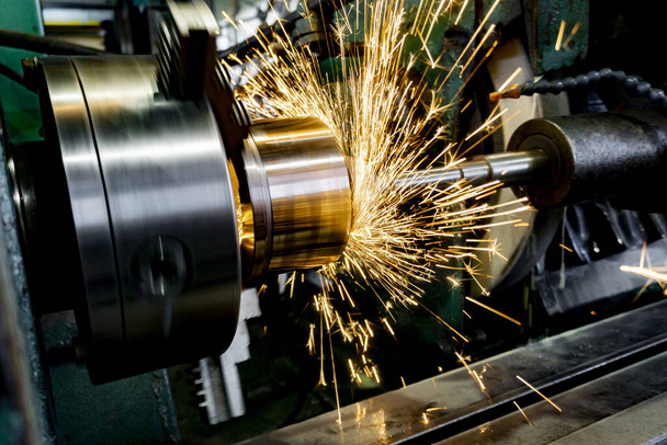 Internal grinding of a part on a cylindrical grinding machine. - Photo, Image
