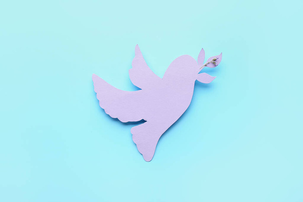 Paper dove on color background. International Day of Peace - Photo, Image