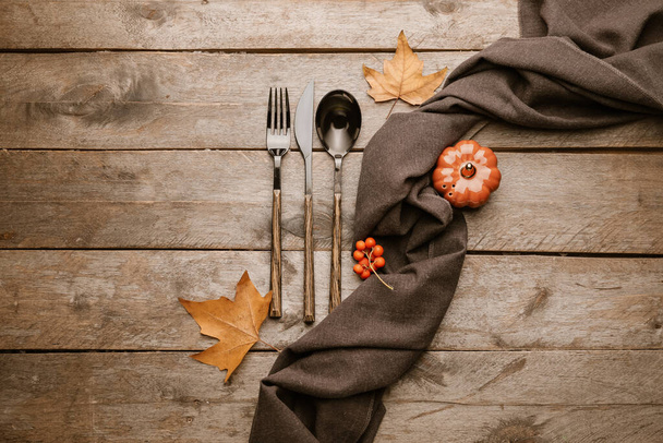 Beautiful table setting with autumn decor on wooden background - Photo, Image