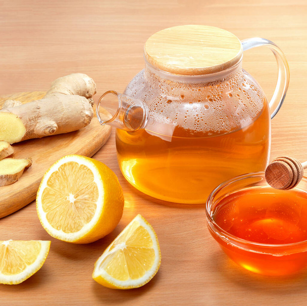 Healthy living herbal tea with lemon, honey and ginger root. - Photo, image
