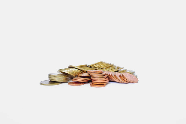 A stacked of coins on white background - Photo, image