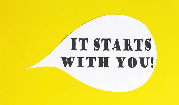 It Starts With You speech bubble isolated on yellow background. - Photo, Image
