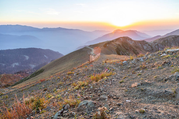 Colorful sunset and autumn mountain landscape in the resort of Rosa Khutor in Russia - Photo, Image