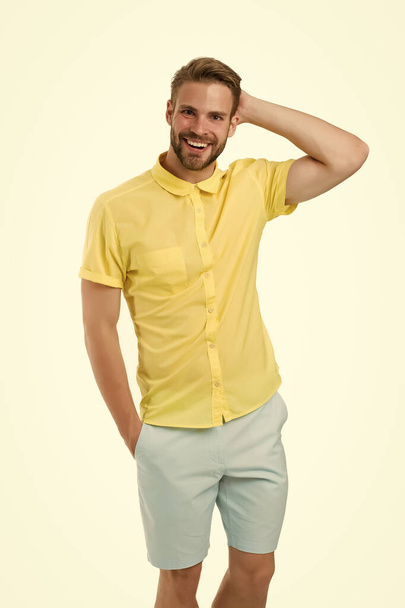 Cheerful and stylish. students life concept. happy guy isolated on white. got his first job. casual cosy summer fashion. Happy guy smiling. natural facial expression. Fashion portrait of young man - Foto, Imagen