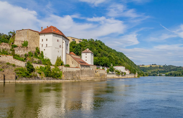 waterside impression of Passau including the Veste Niederhaus in Lower Bavaria in Germany at summer time - Photo, Image