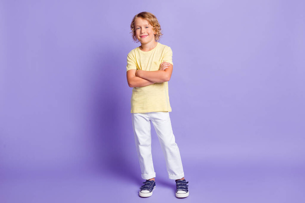 Full length photo of charming kid boy cross hands wear stylish clothes isolated over purple color background - Fotografie, Obrázek