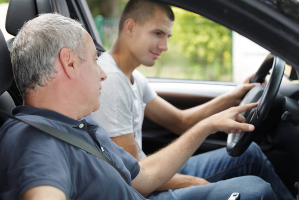 young man having a accompanied driving lesson - Foto, immagini
