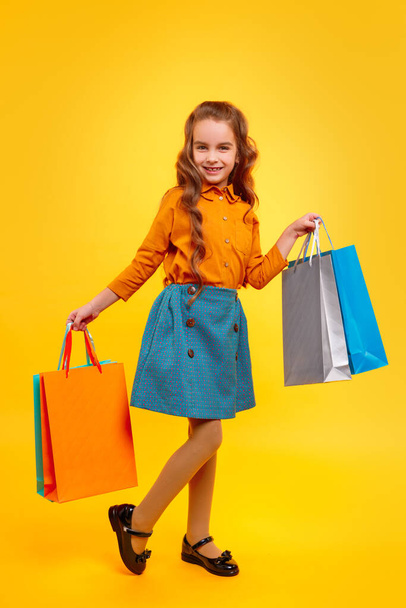 Little shopper with paper bags - Φωτογραφία, εικόνα