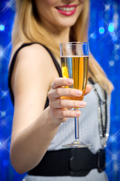 Woman holding glass of champagne - Photo, image