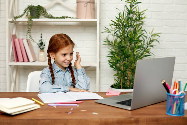 little child girl using laptop for studying online - Fotoğraf, Görsel