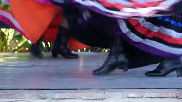 Latino women in colourful traditional dresses dancing Jarabe tapatio, mexican national folk hat dance. Street performance of female hispanic ballet in multi colored ethnic skirts. Girls in costumes - Footage, Video