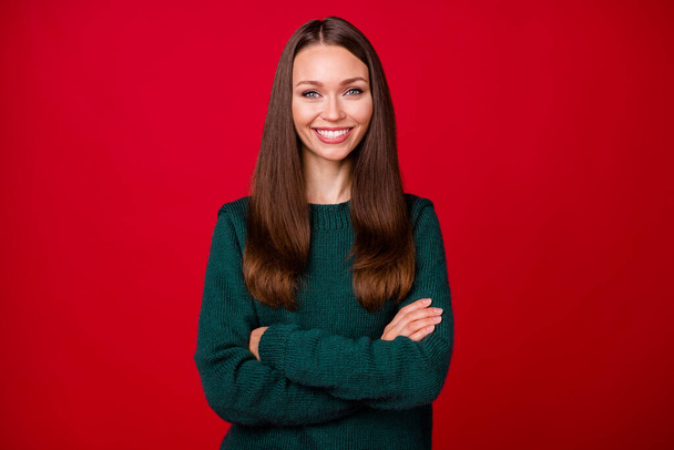 Photo of charming girl cross hands toothy smile in camera isolated over vivid red color background - Foto, afbeelding