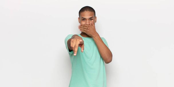 young black man laughing at you, pointing to camera and making fun of or mocking you - Photo, image