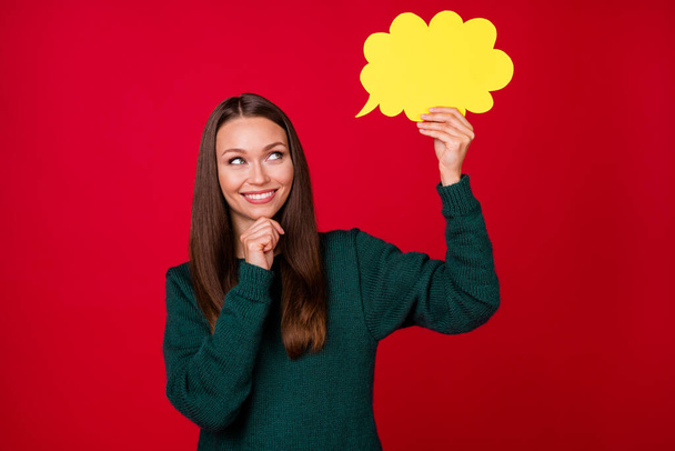 Photo of smart girl hold paper card bubble think wear pullover isolated over shine red color background - Foto, Imagem
