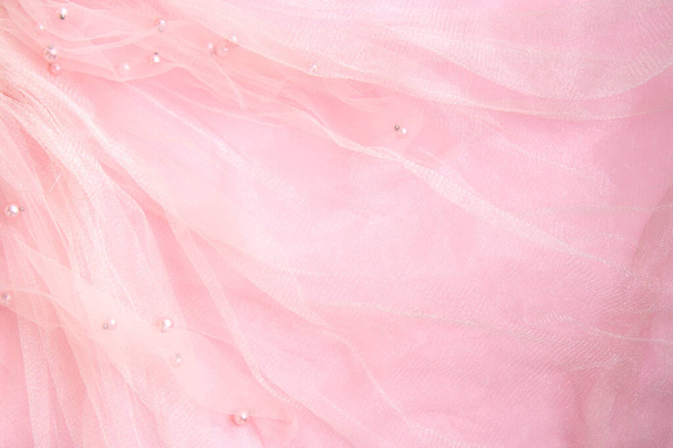Mooie roze tule met glanzende kralen achtergrond - Foto, afbeelding