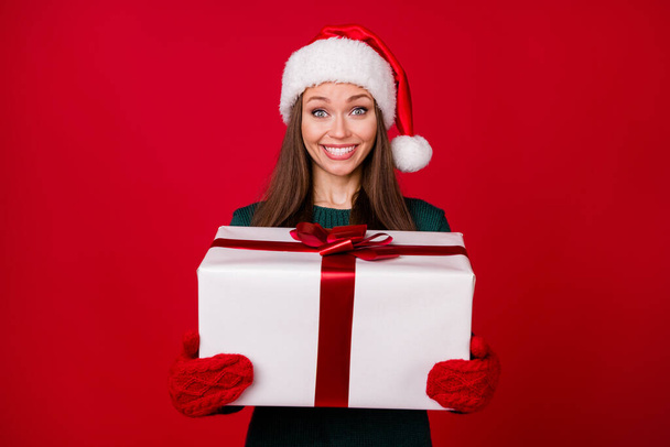 Portrait of her she nice-looking attractive charming glad cheerful cheery girl holding in hands big giftbox festal day isolated over bright vivid shine vibrant red color background - Fotografie, Obrázek