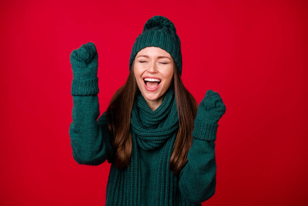 Close-up portrait of her she nice attractive ecstatic dreamy cheerful cheery girl wear wool knit rejoicing celebrating great luck isolated over bright vivid shine vibrant red color background - Fotoğraf, Görsel