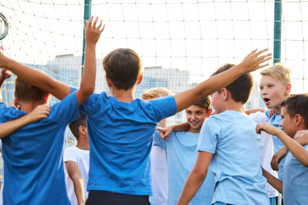 happy group of children celebrate their win in sport competition - Fotoğraf, Görsel