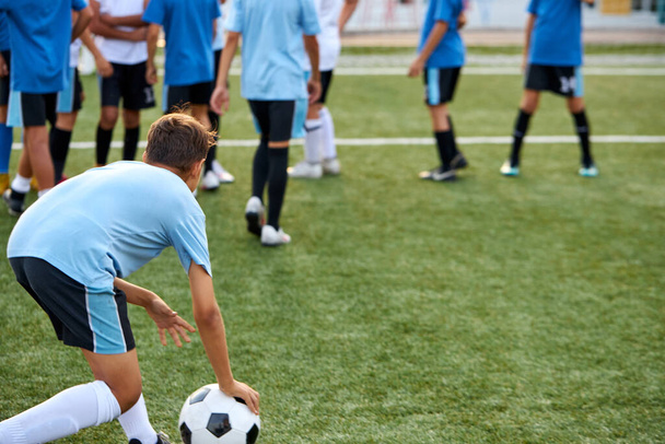 training and football match between youth soccer teams in stadium - Φωτογραφία, εικόνα