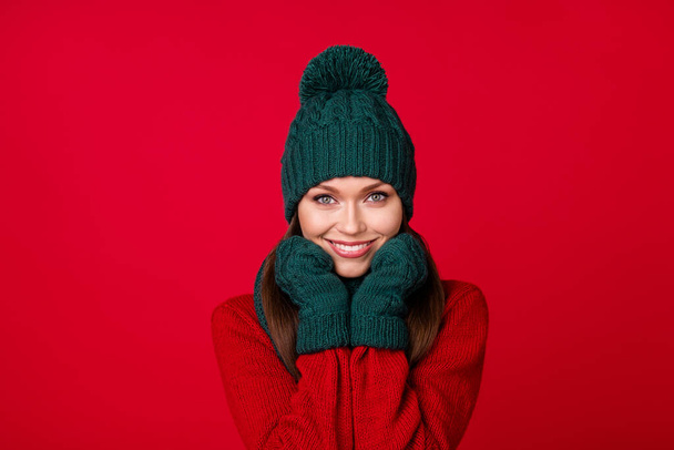 Close-up portrait of her she nice attractive pretty lovely charming cute cheerful cheery girl enjoying cozy warm cloth isolated over bright vivid shine vibrant red color background - Photo, image
