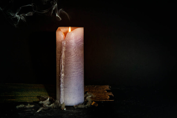 White candle on a dark background - 写真・画像