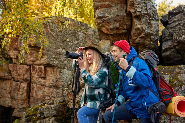 enthusiastic happy tourists on mountains or rocks - Фото, зображення