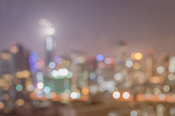 Blur city background rooftop view of Bangkok cityscape business building landscape night lights bokeh   - Photo, Image