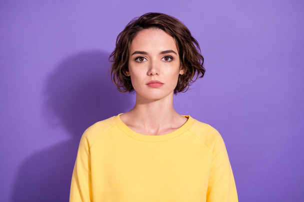 Portrait of pretty serious girl look in camera wear bright sweatshirt isolated over purple color background - Fotografie, Obrázek