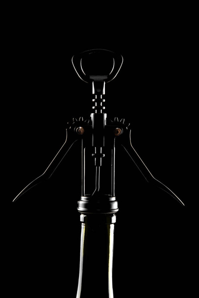Backlight bottle and mechanical corkscrew - Valokuva, kuva
