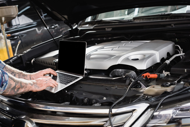 partial view of repairman making diagnostic of car engine compartment - Photo, Image