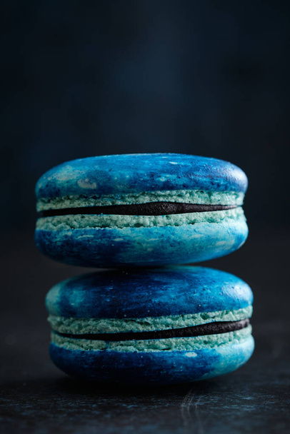 A couple of Ultra Violet macaroons and macarons with space pattern, macro. - Foto, imagen