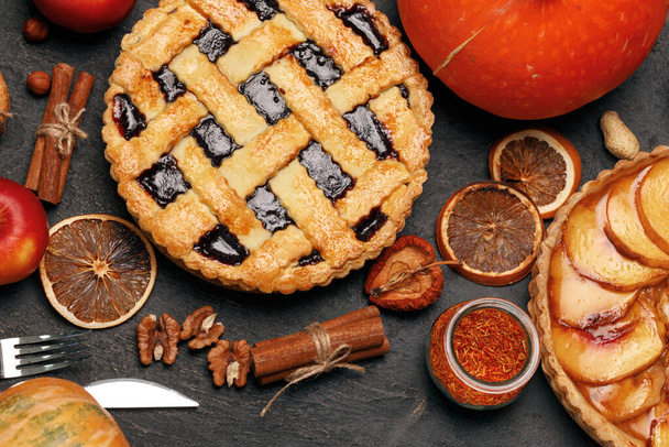 Berry tart pie and apple tart pie on black background - Фото, изображение