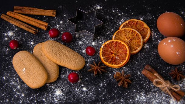 Christmas Baking background. Ingredients for cooking christmas baking on dark stone or metal background. Top view. - Φωτογραφία, εικόνα