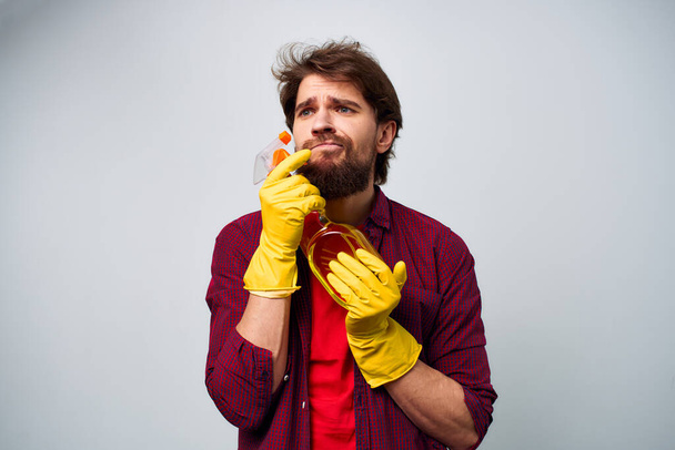 Man in yellow gloves detergent cleaning professional cropped view  - Foto, imagen
