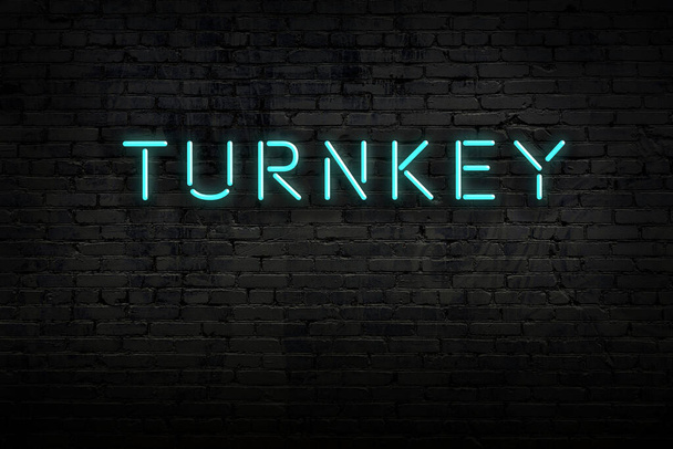 Night view of neon sign on brick wall with inscription turnkey - Photo, Image