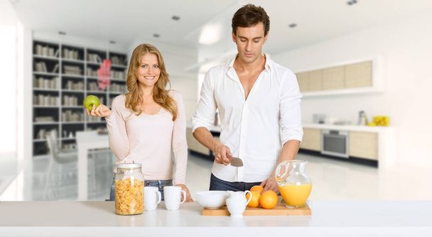 Young couple prepairing a healthy breakfast in a modern luxurious interior - Foto, immagini