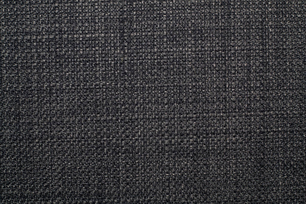 背景は、黒とグレーの色合いで独特の編組織りを持つラフで高密度のリネン生地です。. - 写真・画像
