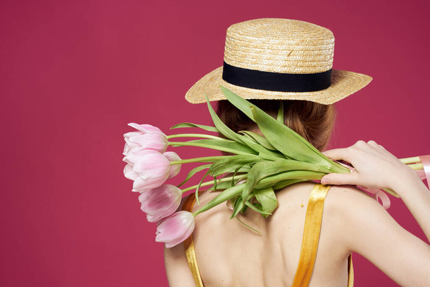 Beautiful woman with a bouquet of flowers a gift as an elegant style lifestyle - Photo, Image